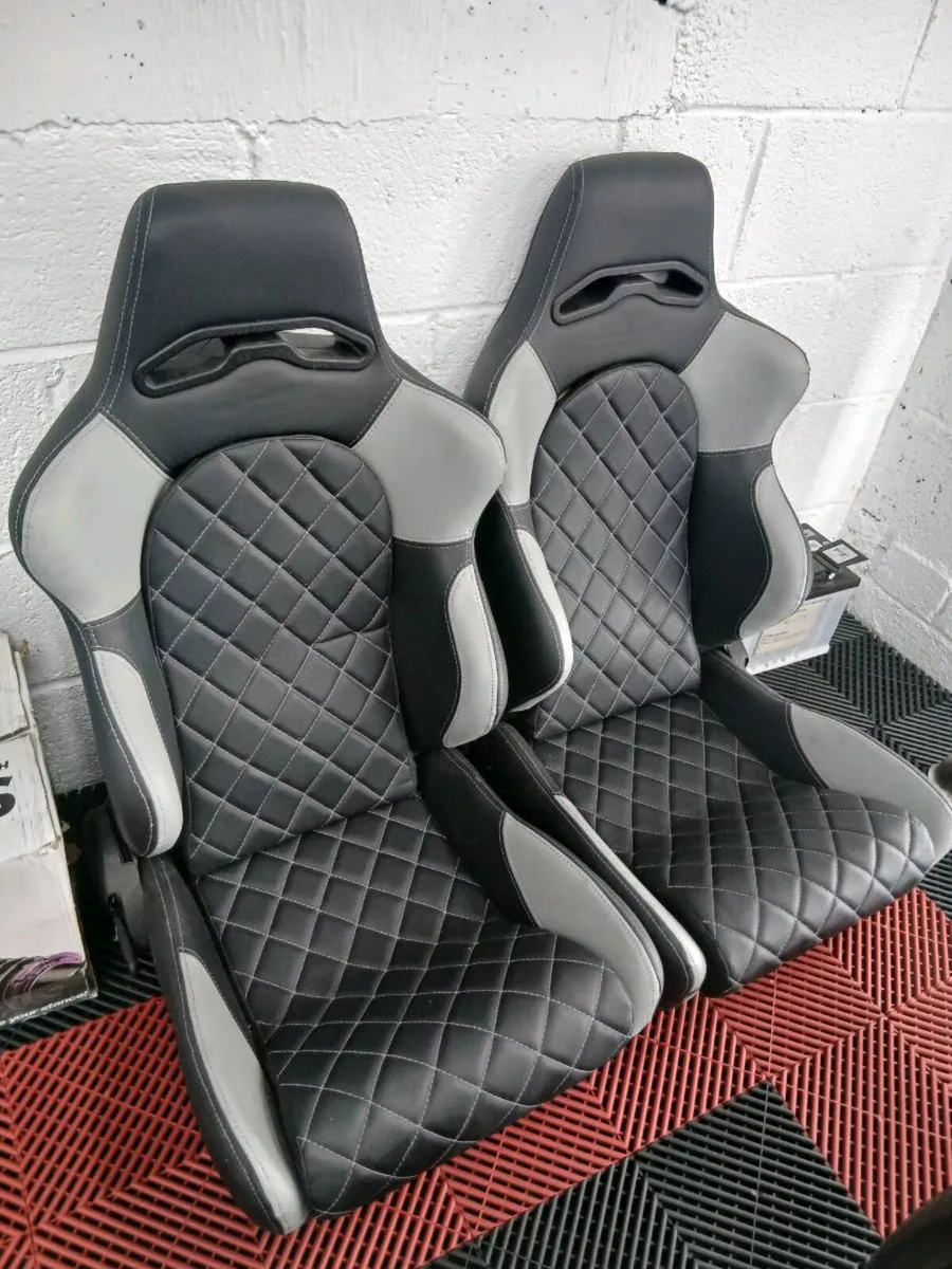 Universal Bucket seats with sliding rails.