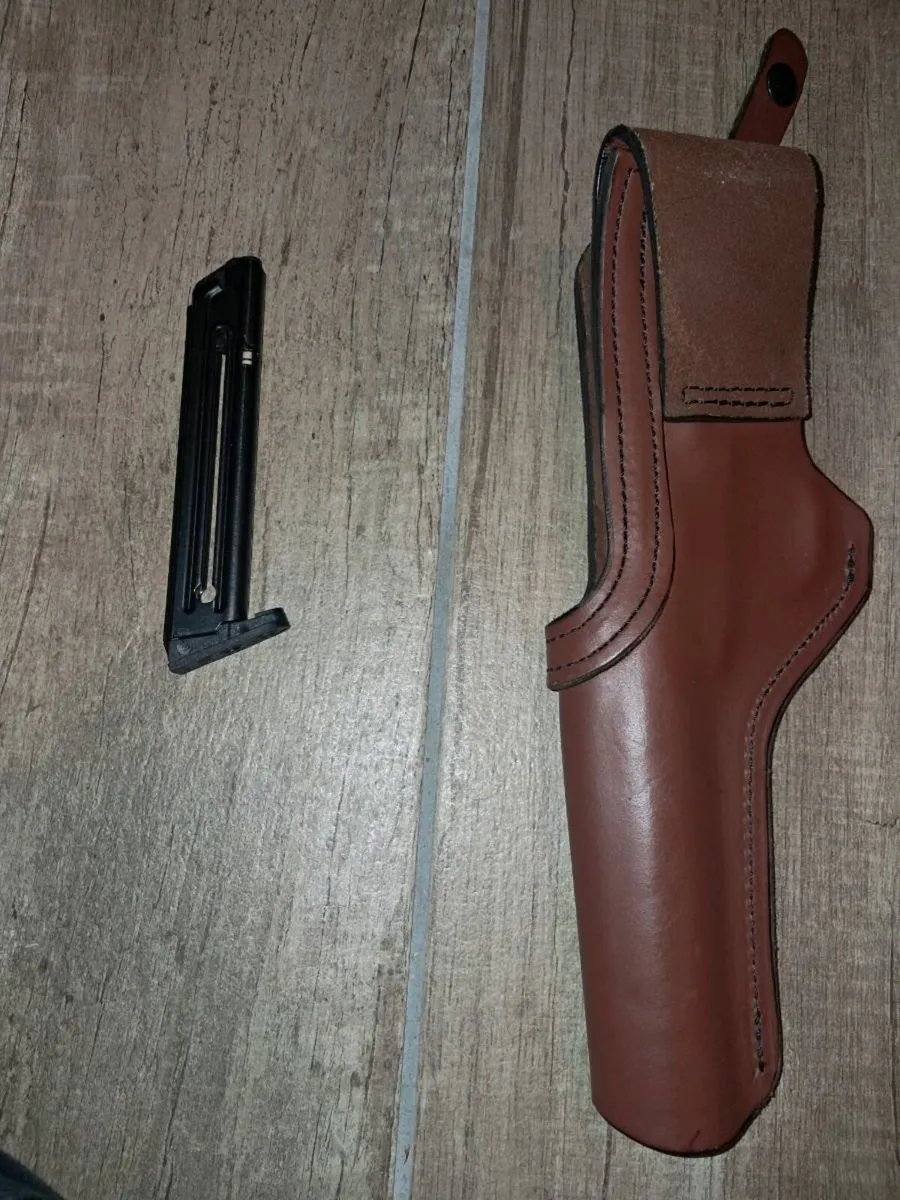 Pistol holster and magazine - Image 1