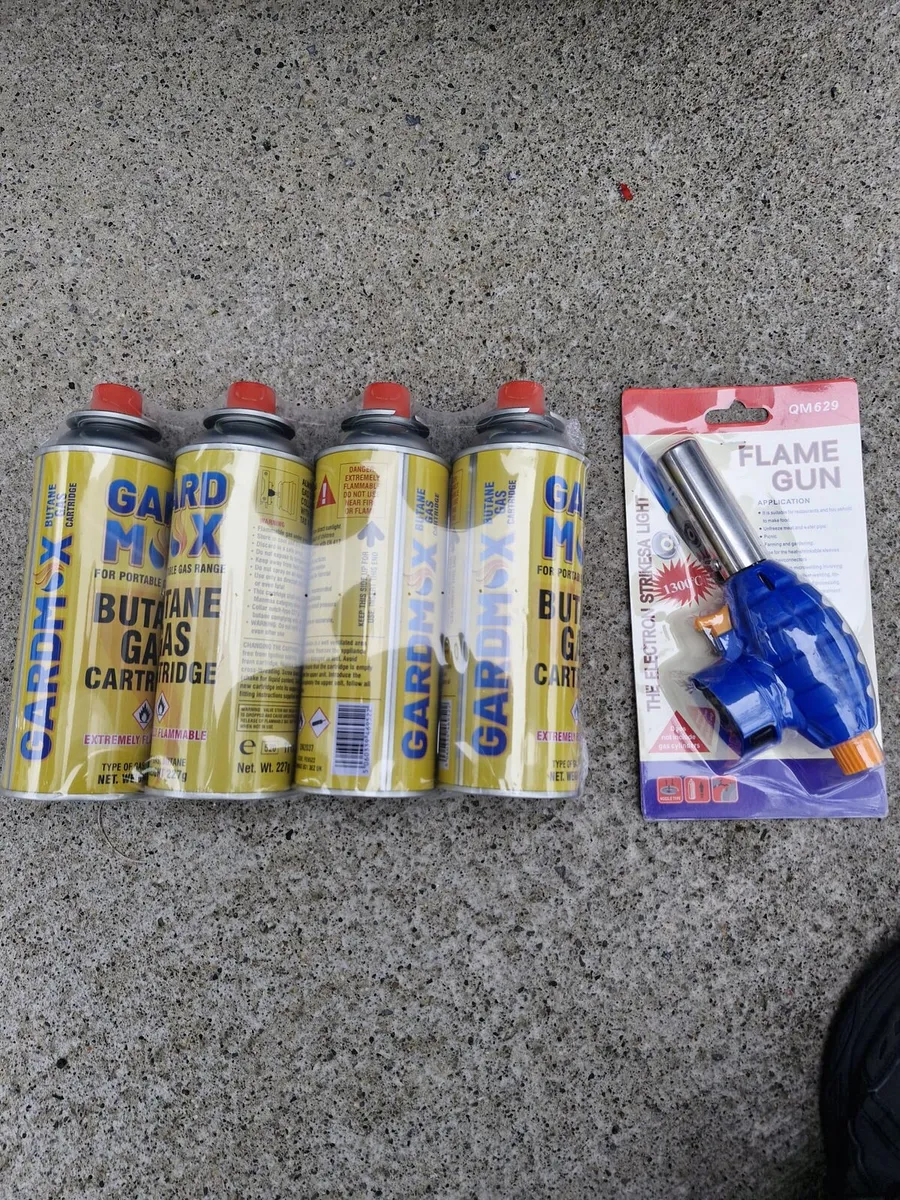4 gas canisters and torch head