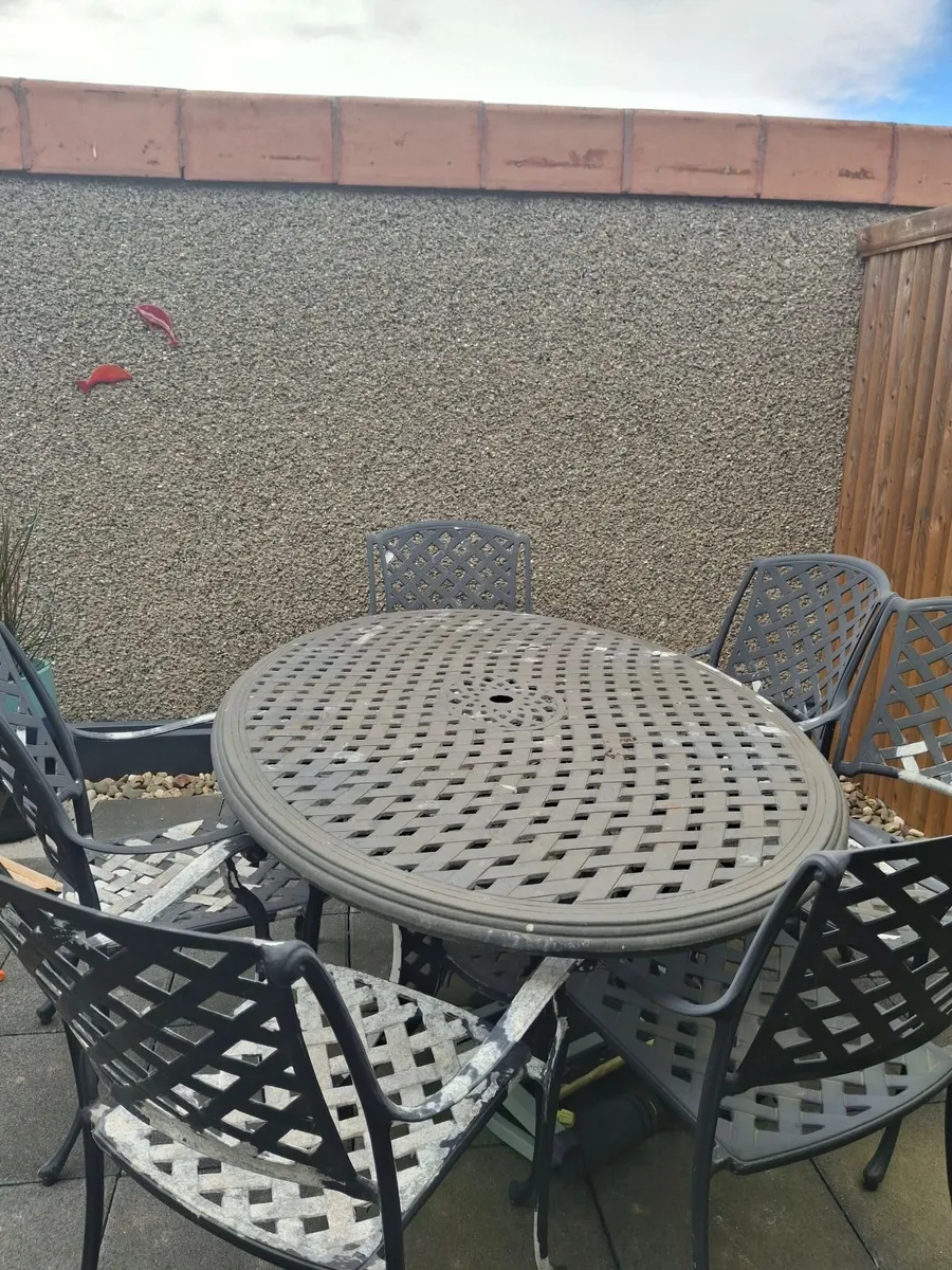 Cast iron table and 6 chairs
