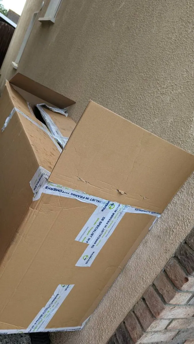 V. Large cardboard box