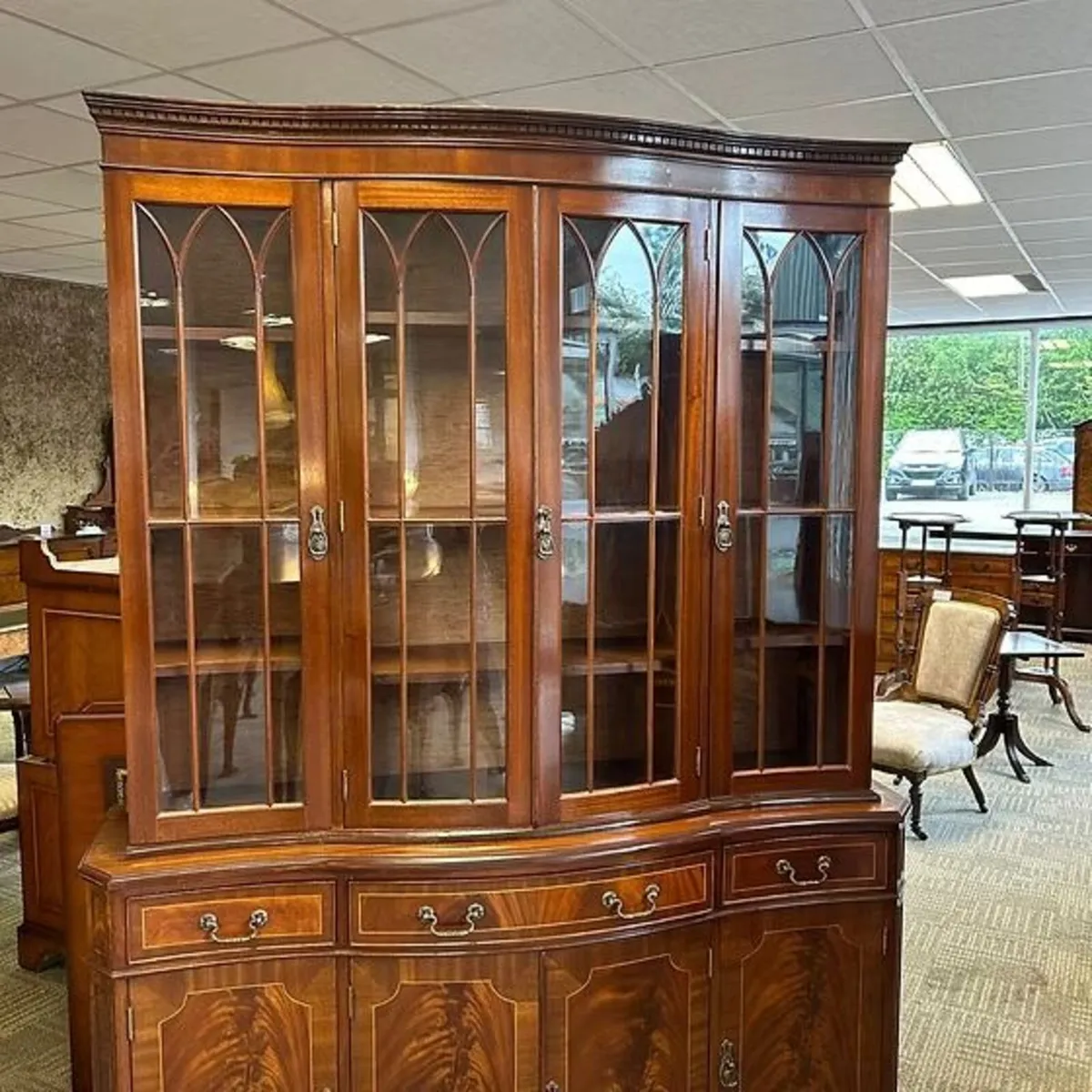 Mahogany flamed bow fronted four door display cabi