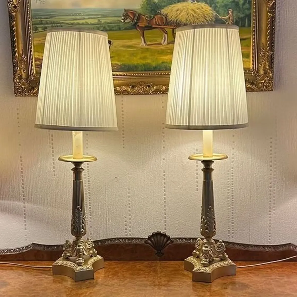 A pair of gilt painted candlestick shaped white sh