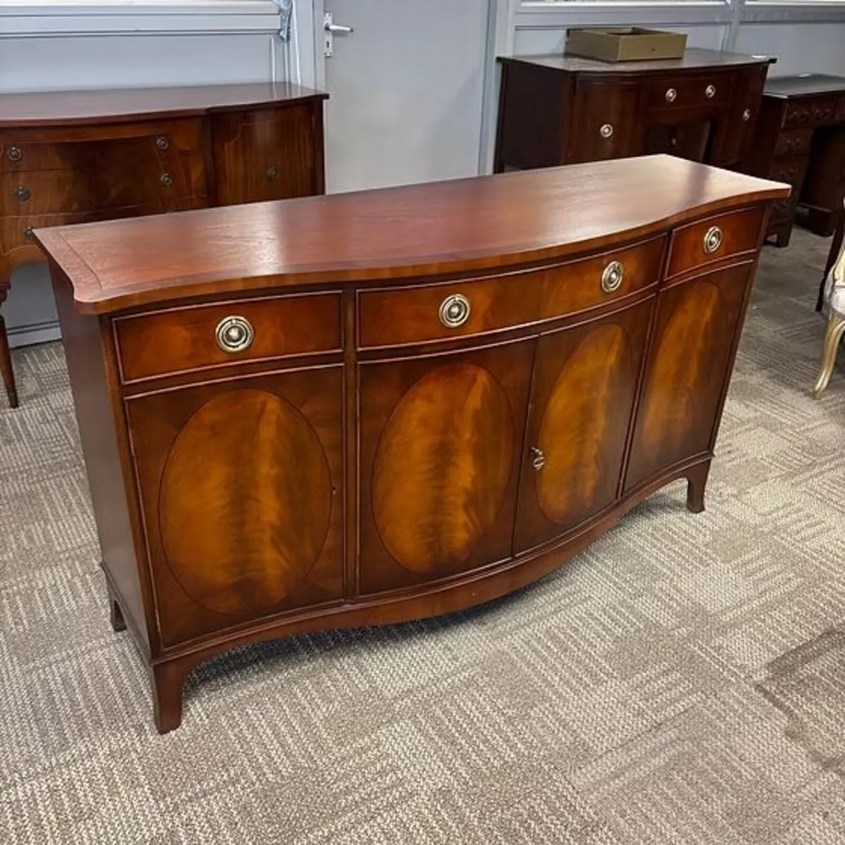 Fabulous mahogany flamed bow front four drawer / d