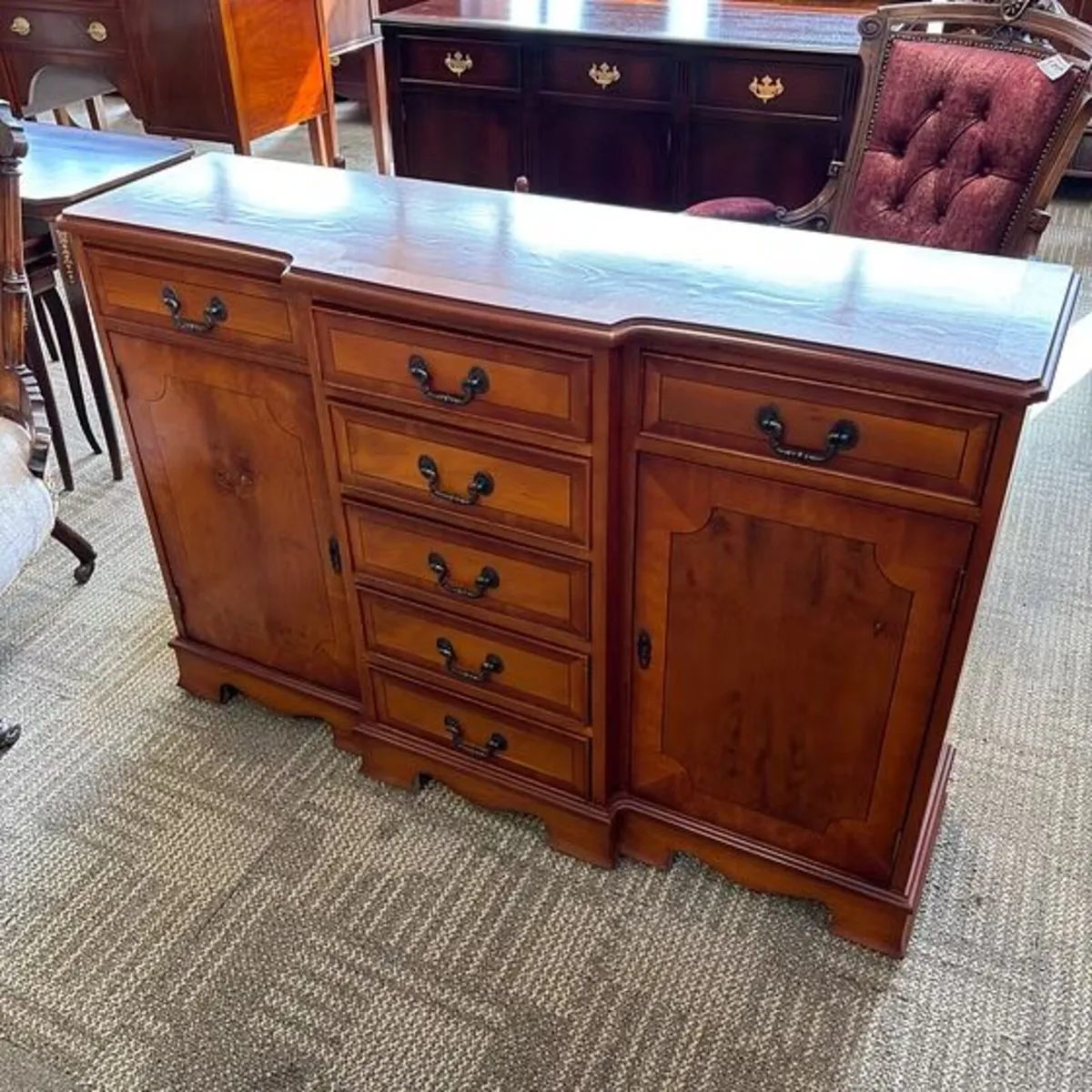 Yew flamed breakfront sideboard