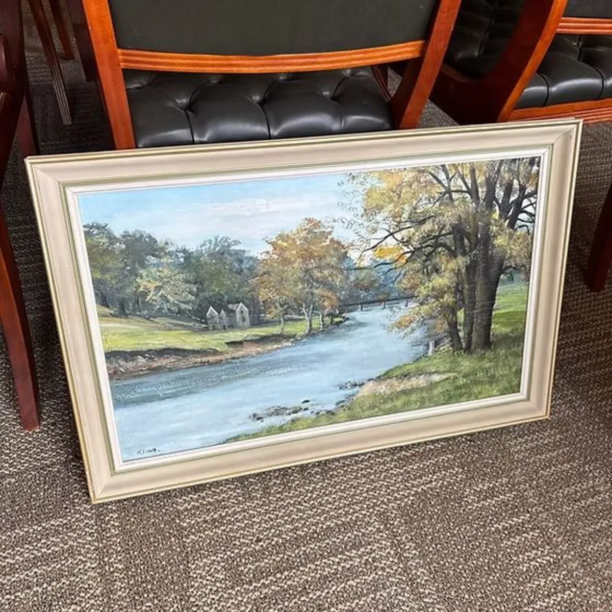 Lake with small house in the background oil on can