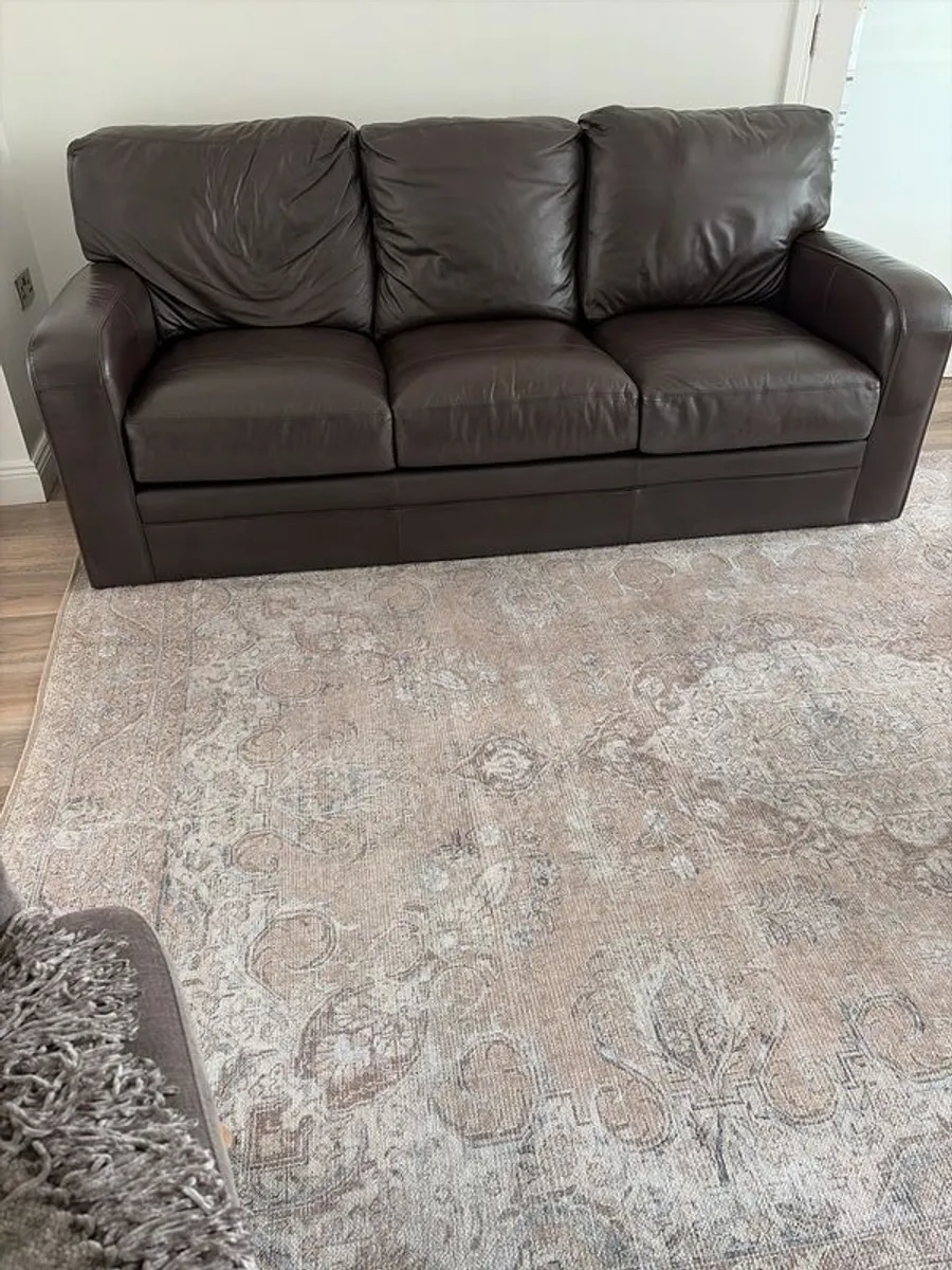 2 Italian Brown leather sofas and footstools - Image 1