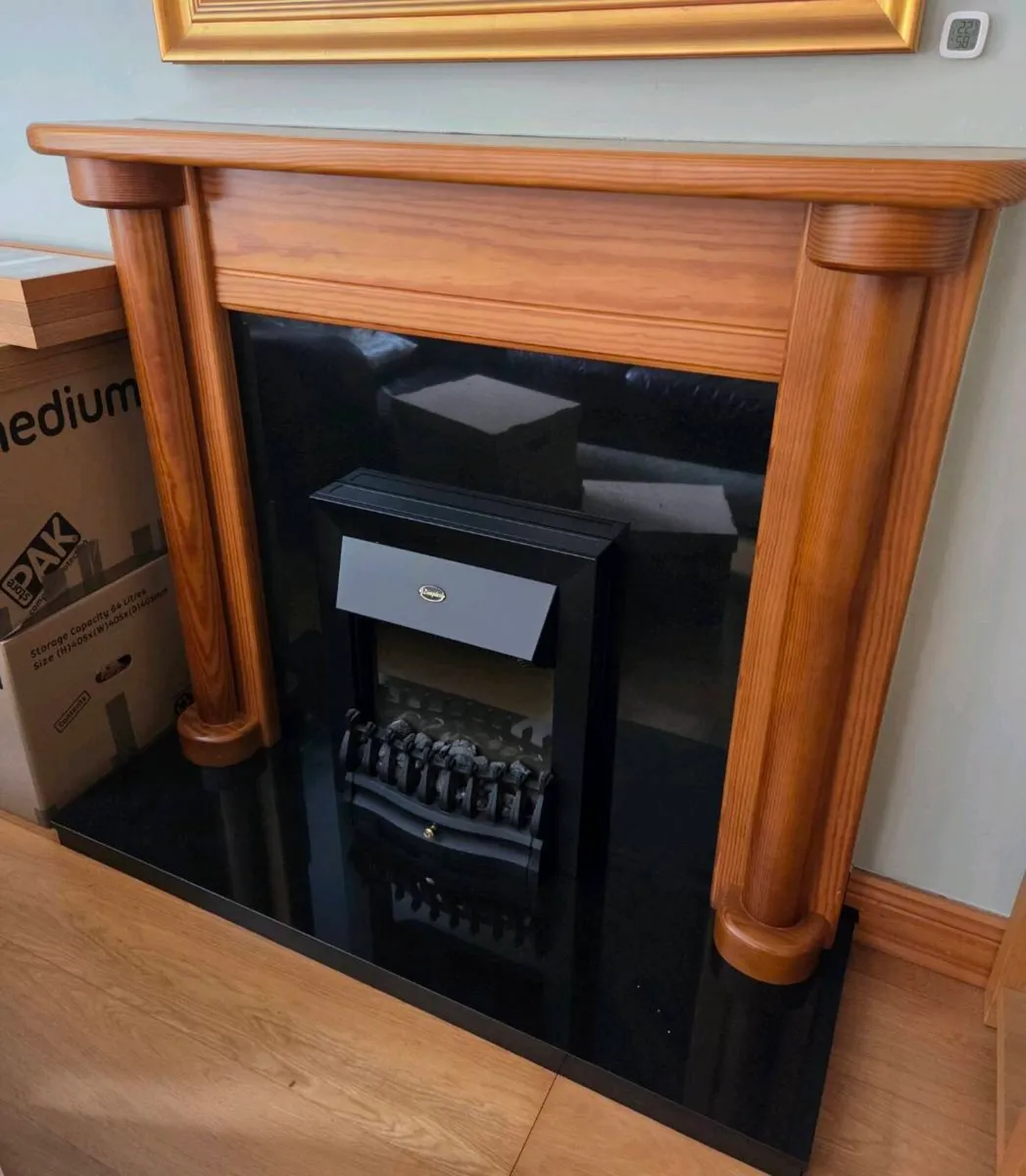 Fireplace, marble surrounding and electric fire