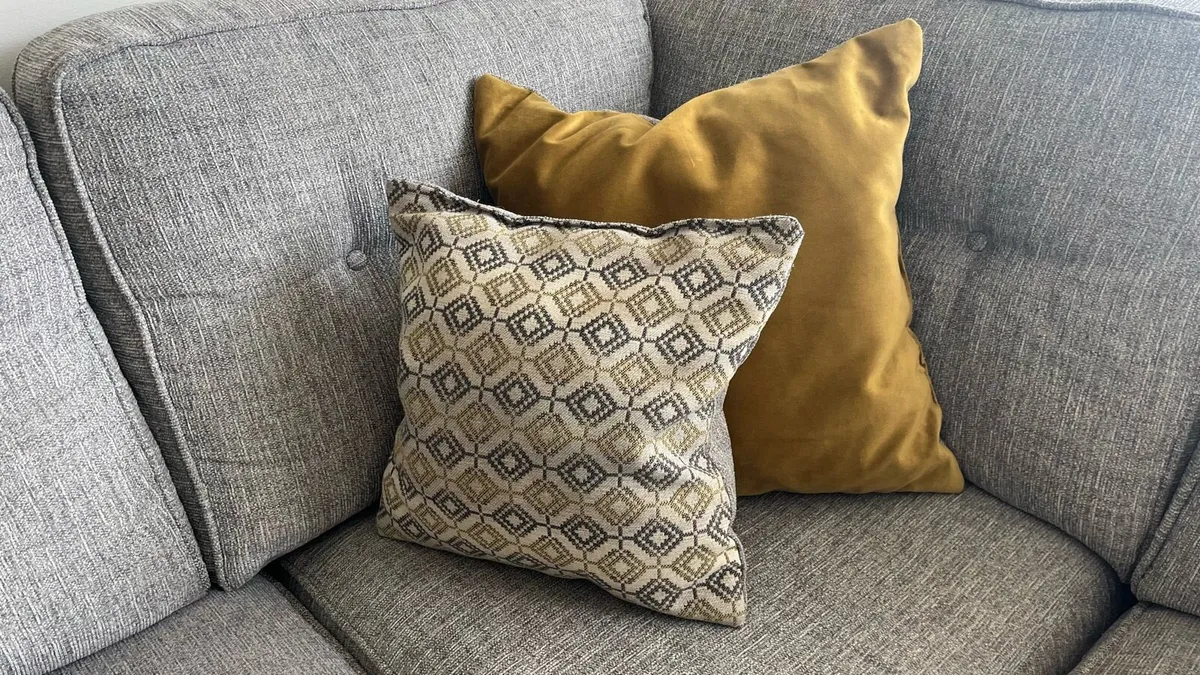 L shape couch with pouffe and matching cushions - Image 4
