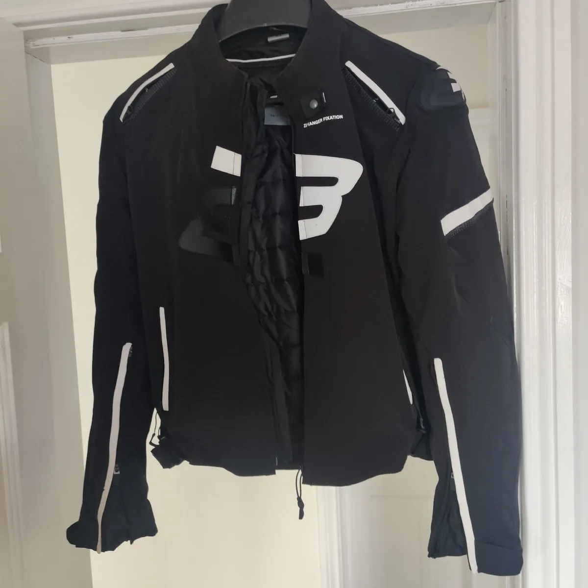 Motorcycle jacket and gloves - Image 1