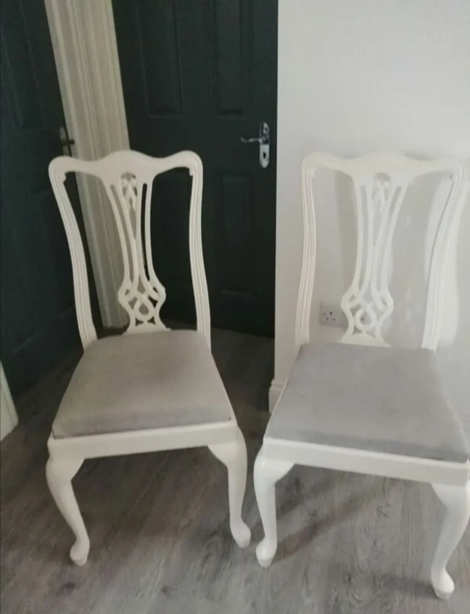 Two cream oak chairs linen padded seats