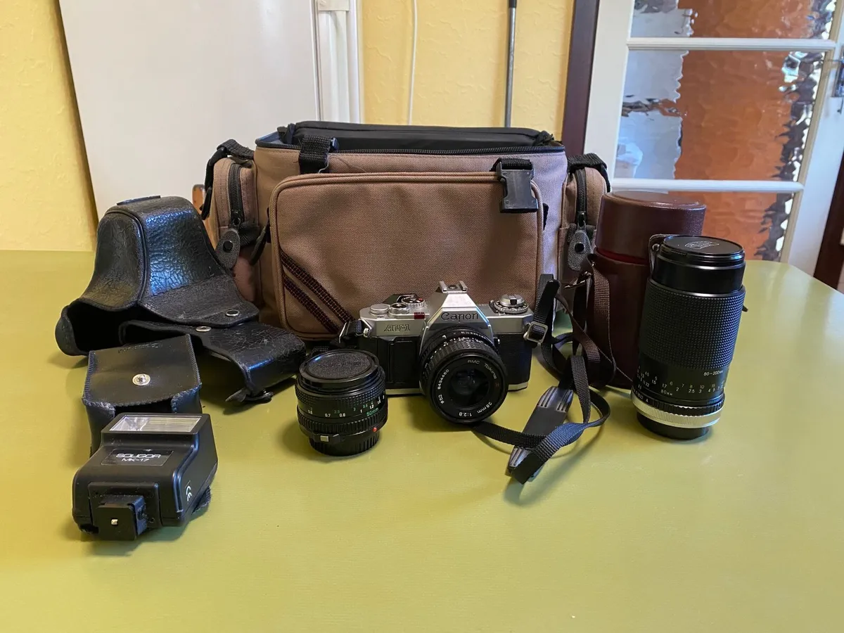 Canon AV-1 camera includes lenses, flash etc