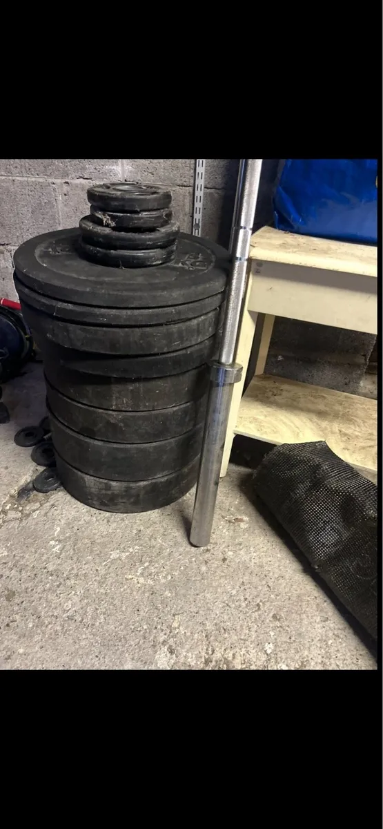 Gym equipment bumper plates and Olympic bar - Image 2
