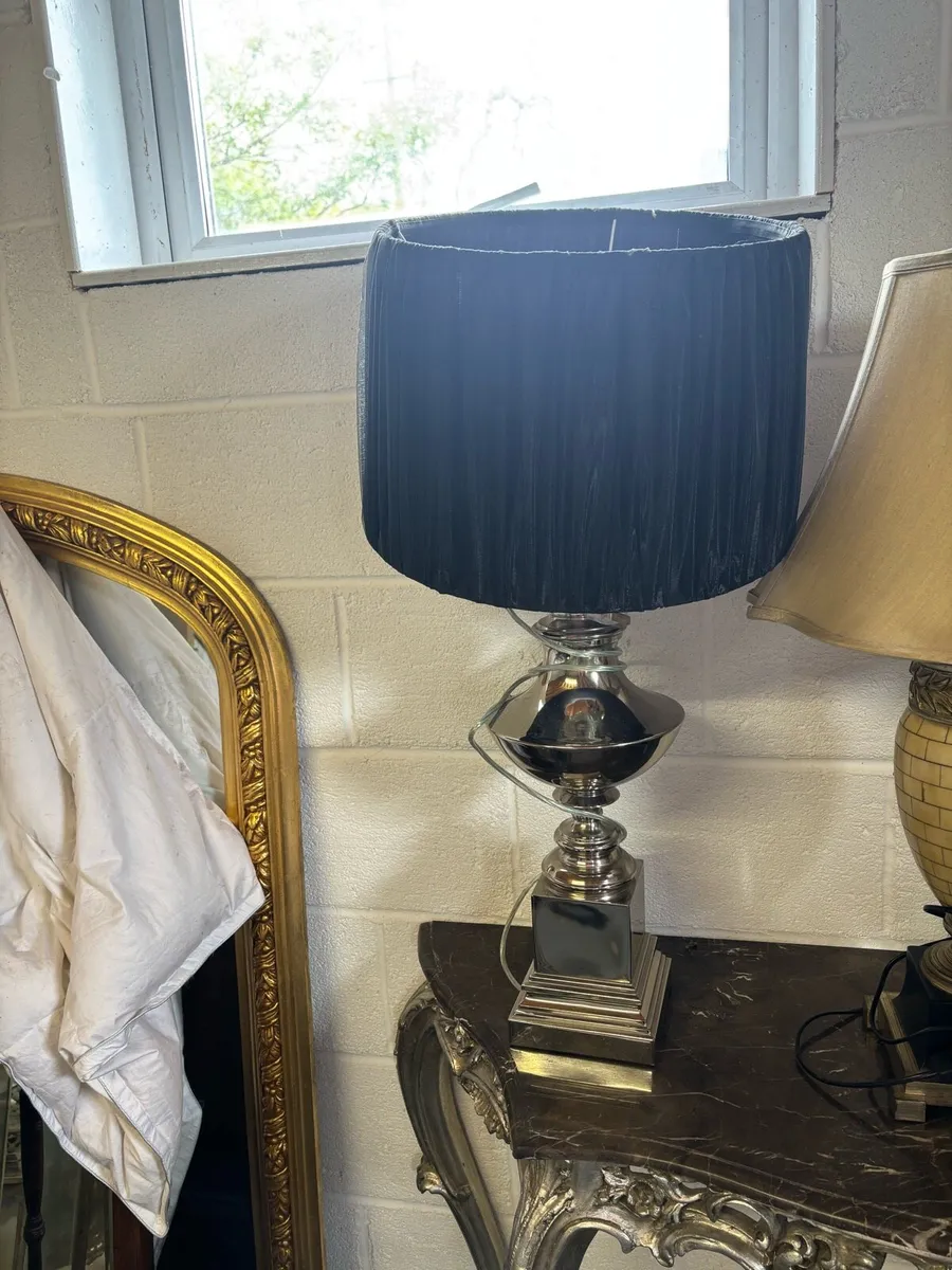 Large silver table lamp with navy blue shade