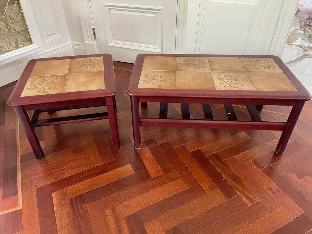 Two Mahogany tiled topped coffee tables