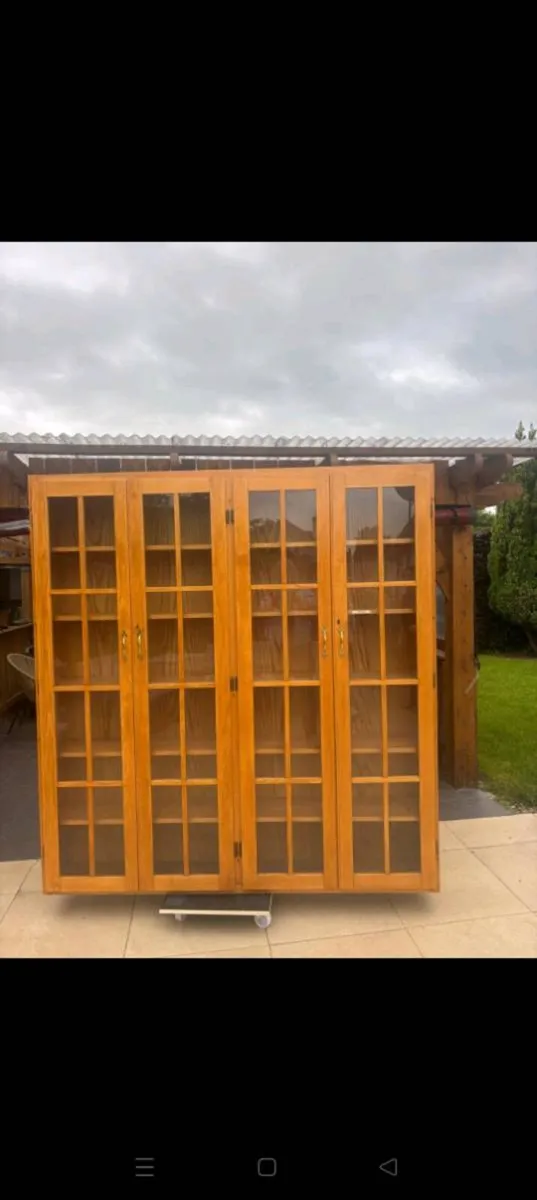 Wooden bookcase with glass panelled doors - Image 1