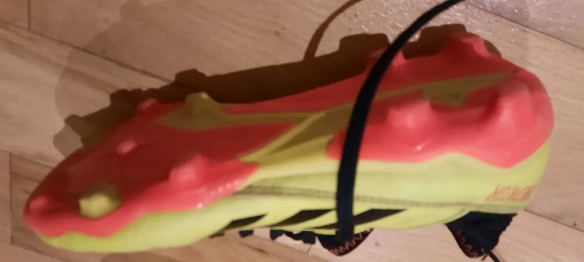 Kids football boots and shin guards - Image 1