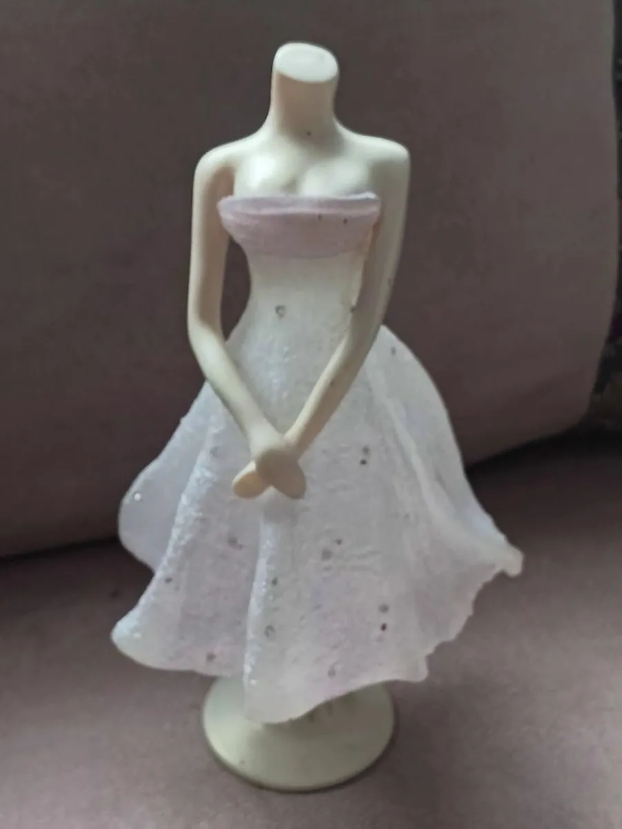 Vintage "The Latest Thing" Collectable Figurine - Image 1