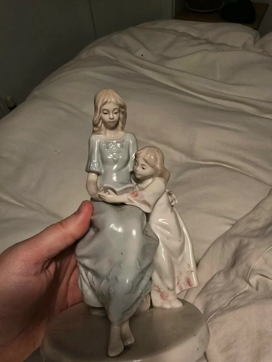 Mother with daughter reading a book