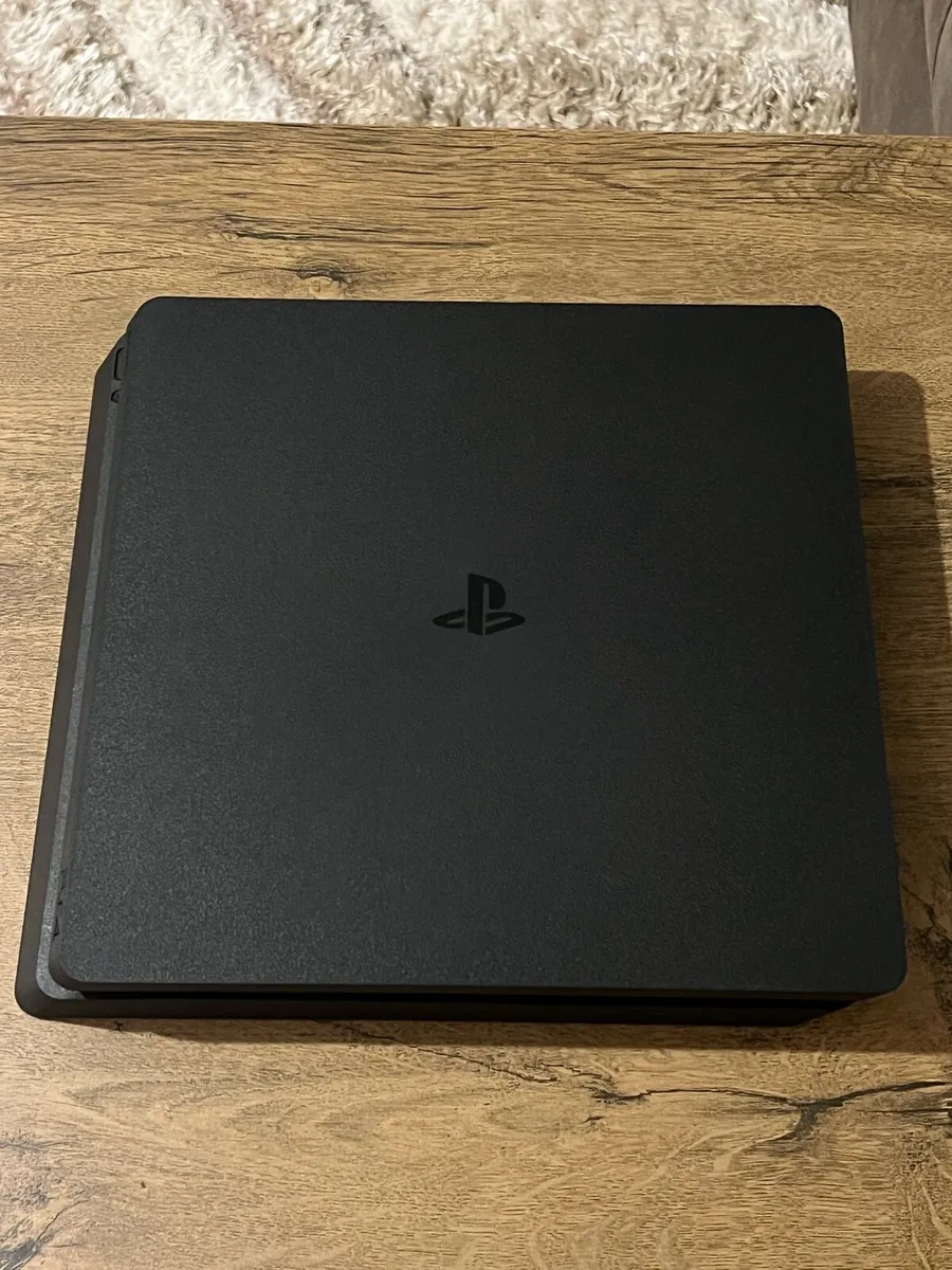 PS4 slim 1TB with controller & 7 games - Image 1