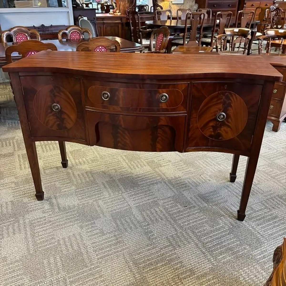 Gorgeous mahogany flamed oval shaped sideboard
