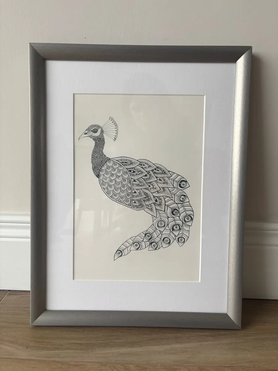 Peacock print in frame