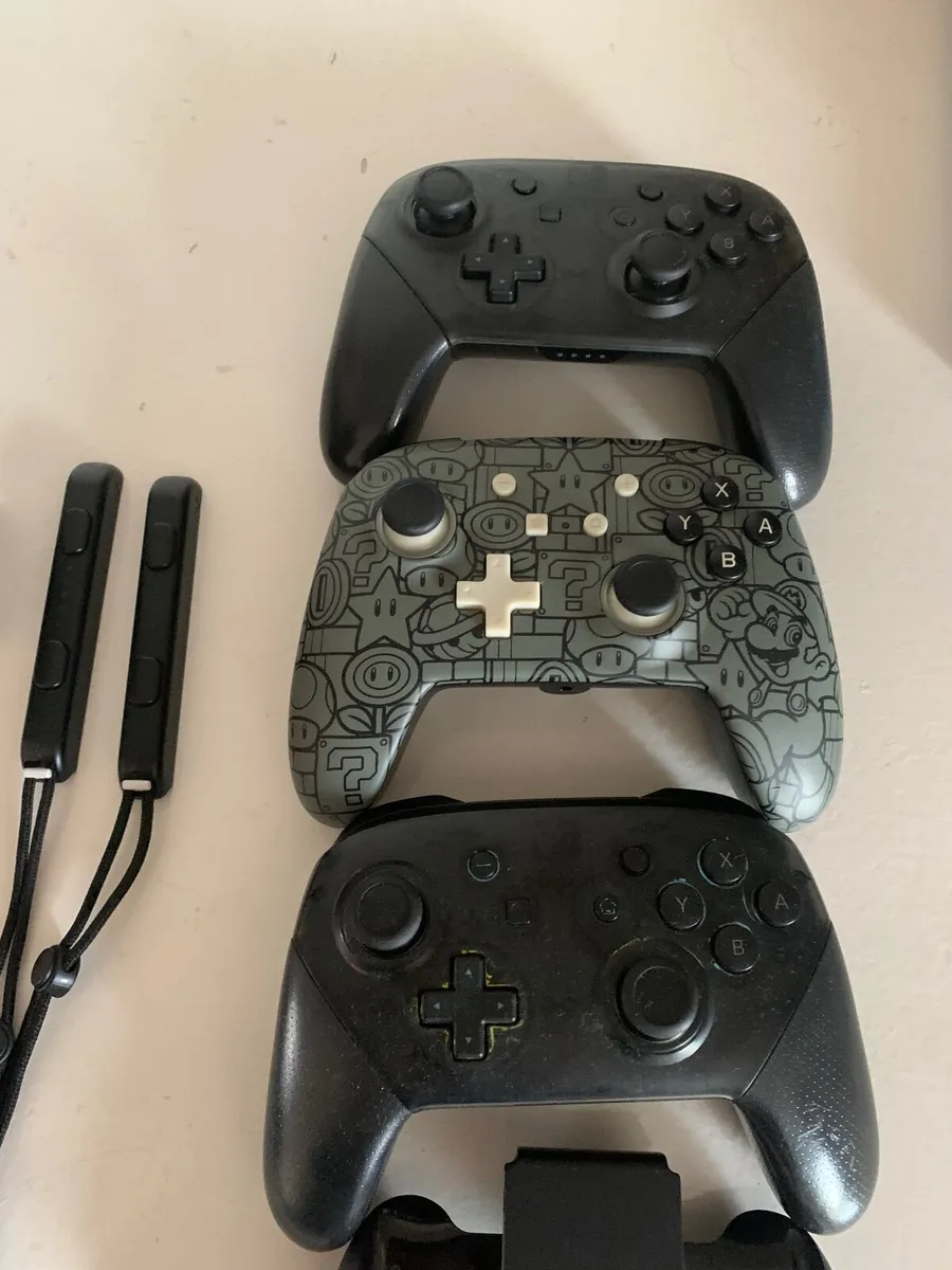 Nintendo Switch with pro controllers - Image 1