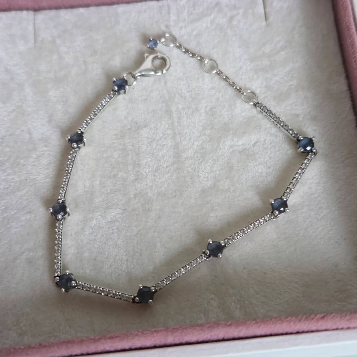 Pandora bracelet with sparkly bars and blue stones - Image 1