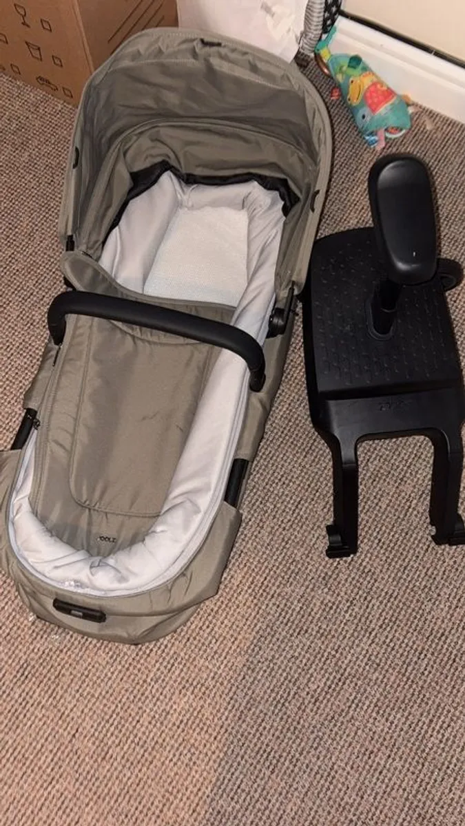 Joolz Aer 2 Carry coat in sage green and buggy board. - Image 2