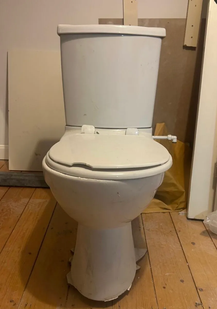 White ceramic close coupled toilet.
