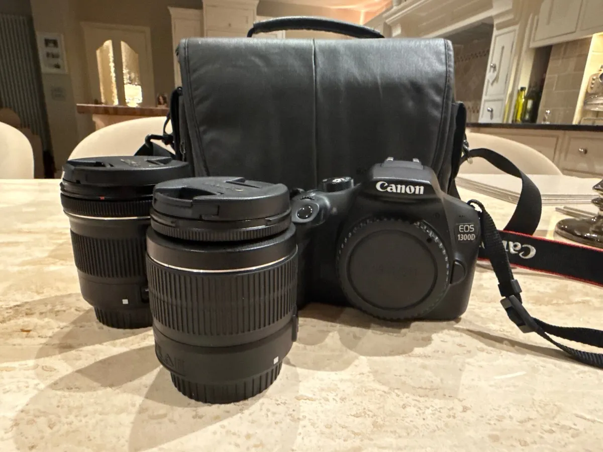Canon EOS 1300D DSLR camera with 2 lenses and case - Image 1