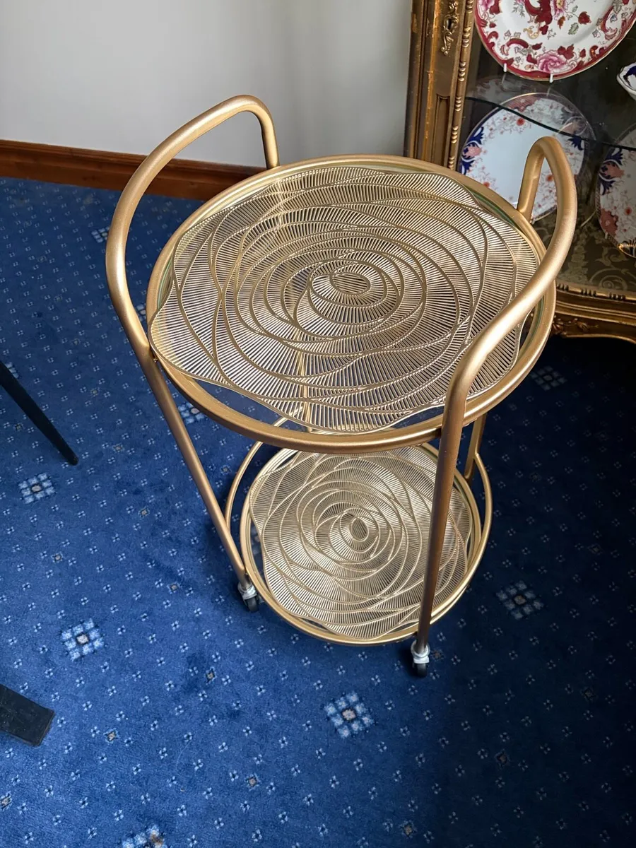 Two tier round glass table gold colour on castors - Image 2