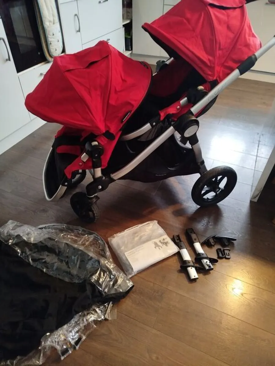 City select jogger twin buggy - perfect for a toddler & a baby. Two toddler seats & one bassinet available with adapters for a car seat. Two footmuffs (not city select brand but they are red) included & a brand new rain over. - Image 2