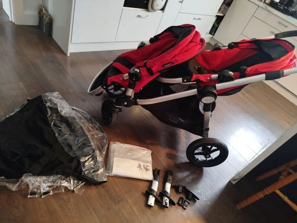 City select jogger twin buggy - perfect for a toddler & a baby. Two toddler seats & one bassinet available with adapters for a car seat. Two footmuffs (not city select brand but they are red) included & a brand new rain over. - Image 4