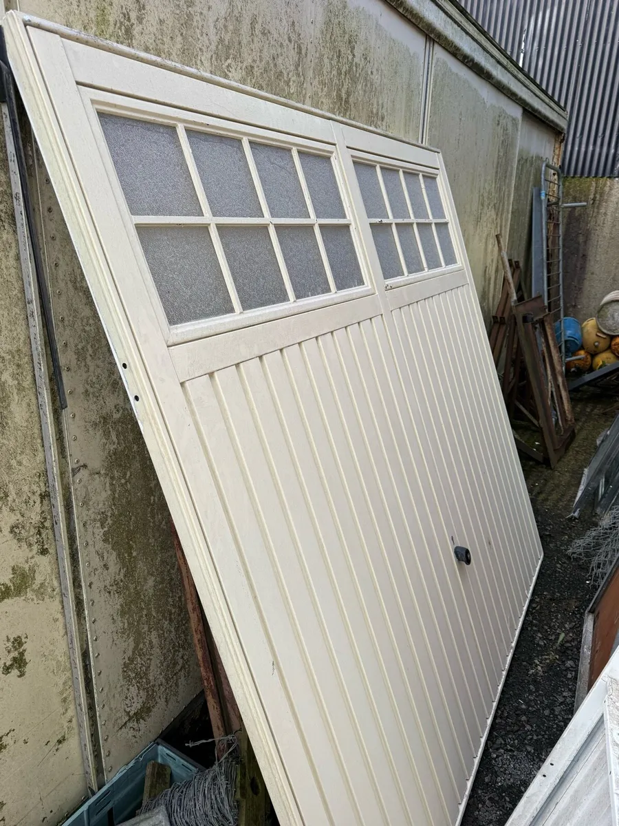 2 used electric garage doors - Image 1