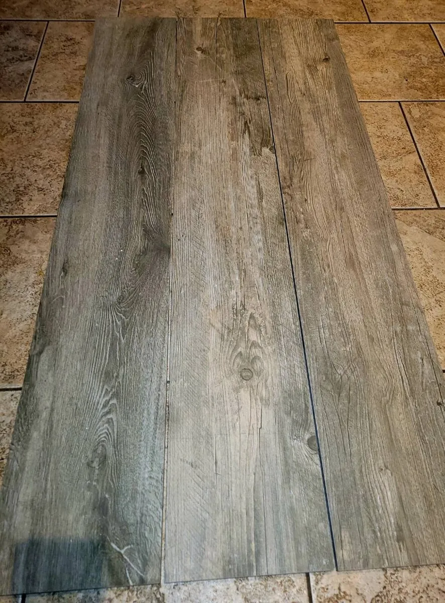 Grey wood effect floor tiles.