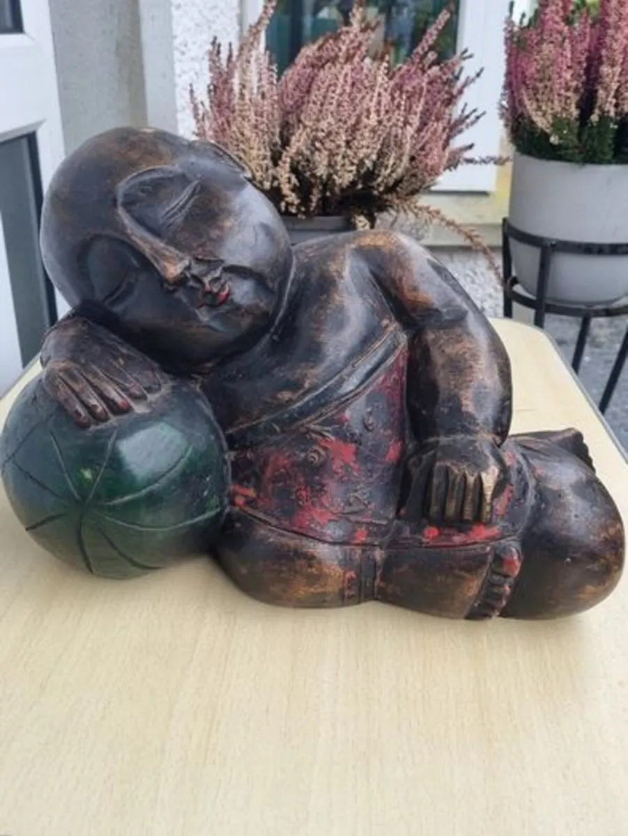 A large wooden statue of a sleeping Buddha - Image 1