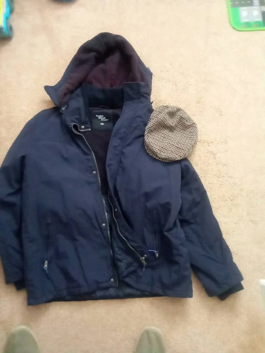 MANS. XL  WINTER  COAT. AND. MANS.  PEAK. CAP - Image 1