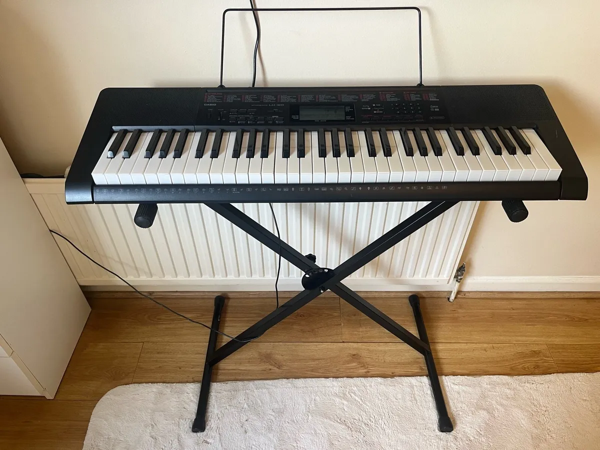 casio piano keyboard with stand and user guide - Image 1