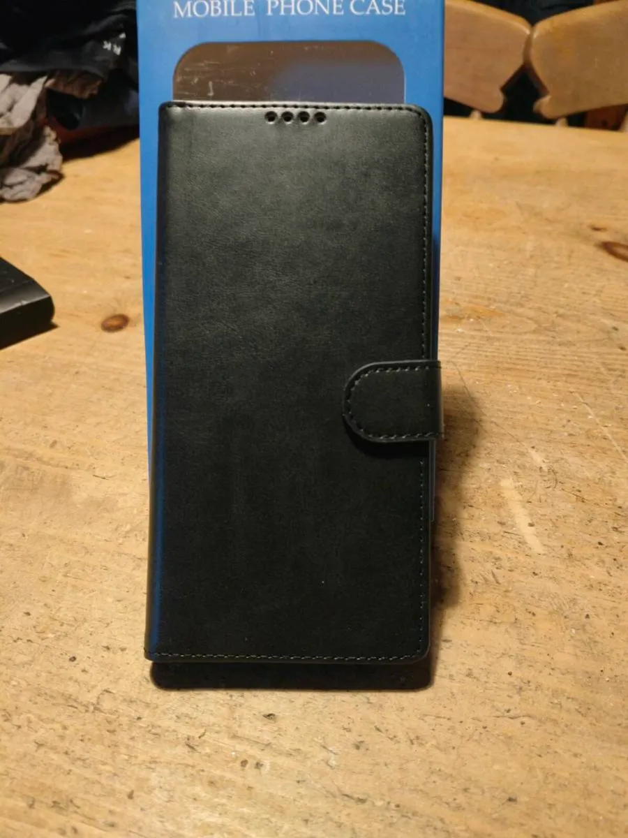 Mobile leather Black phone cover, New in Box.
For - Image 3