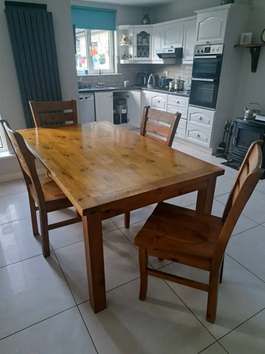 A strong wooden kitchen table  with 4 chairs - Image 1