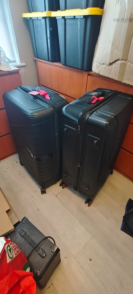 Two Large black suitcases
