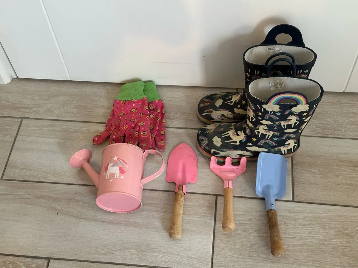 Kids garden tools and boots
