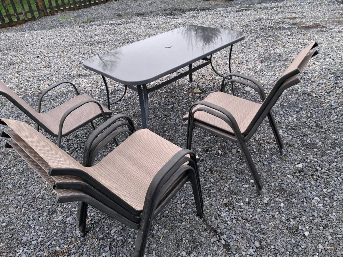 Glass table and 6 chairs - Image 1