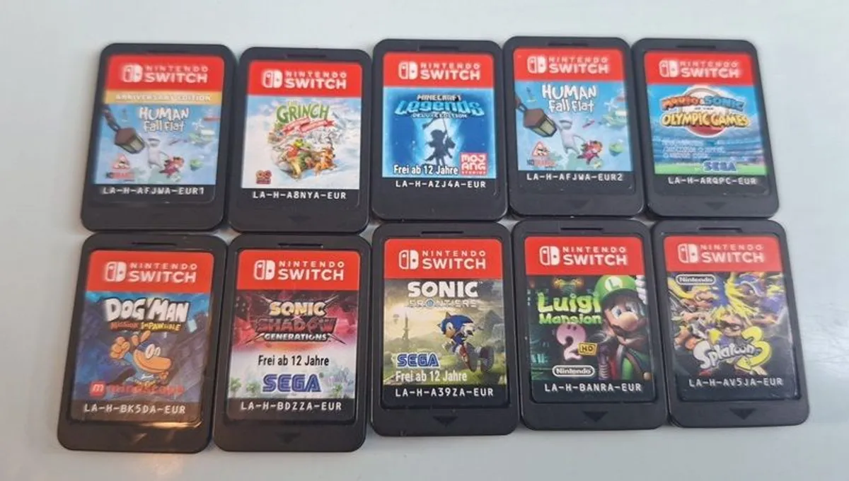 Nintendo Switch Games + Case - Image 1