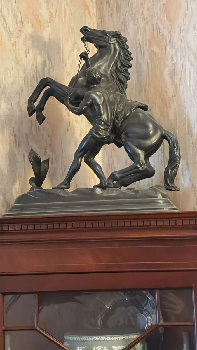 Horse and jockey statue