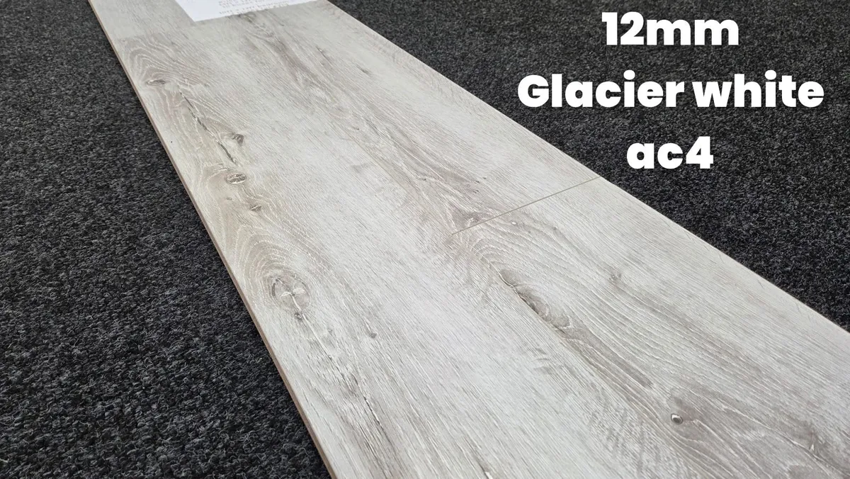 12mm laminated click flooring Delivered - Image 1