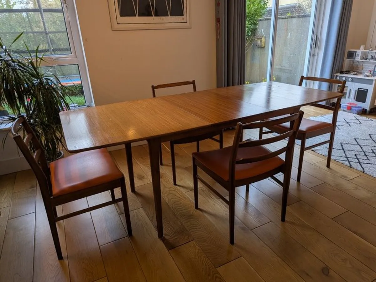 Mid century McIntosh teak extending dining table and 4 teak dining chairs. - Image 1