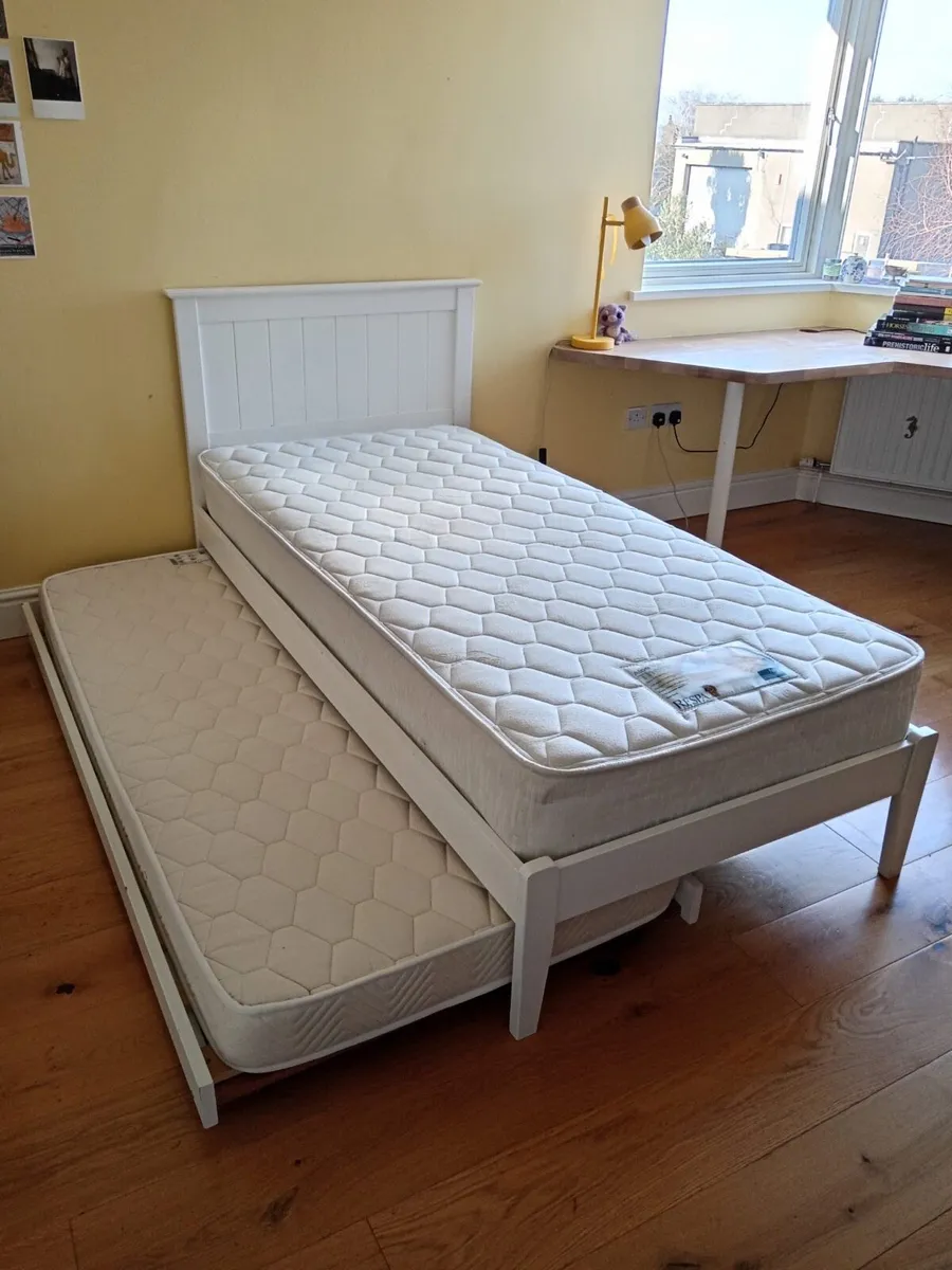 Single bed with rollaway bed under - Image 1