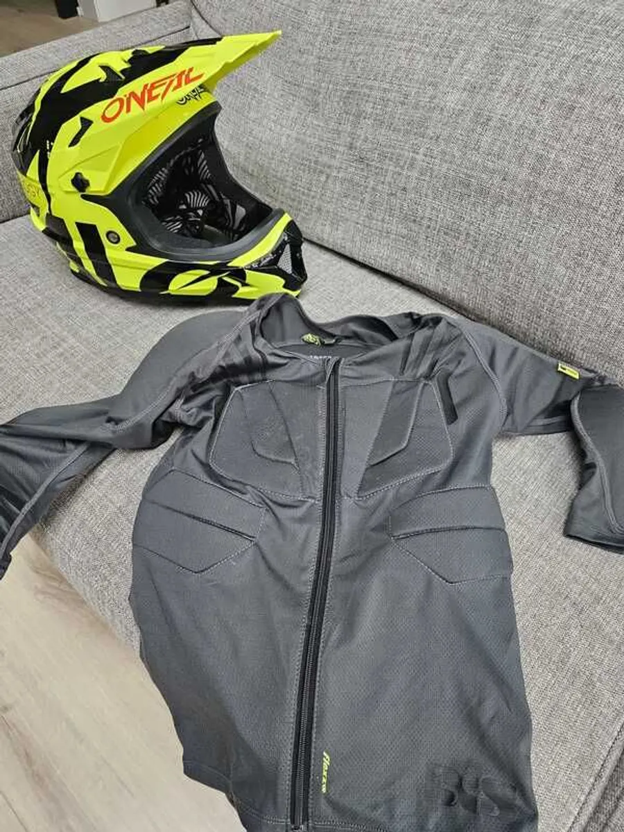 Mountain bike helmet and clothing - Image 1